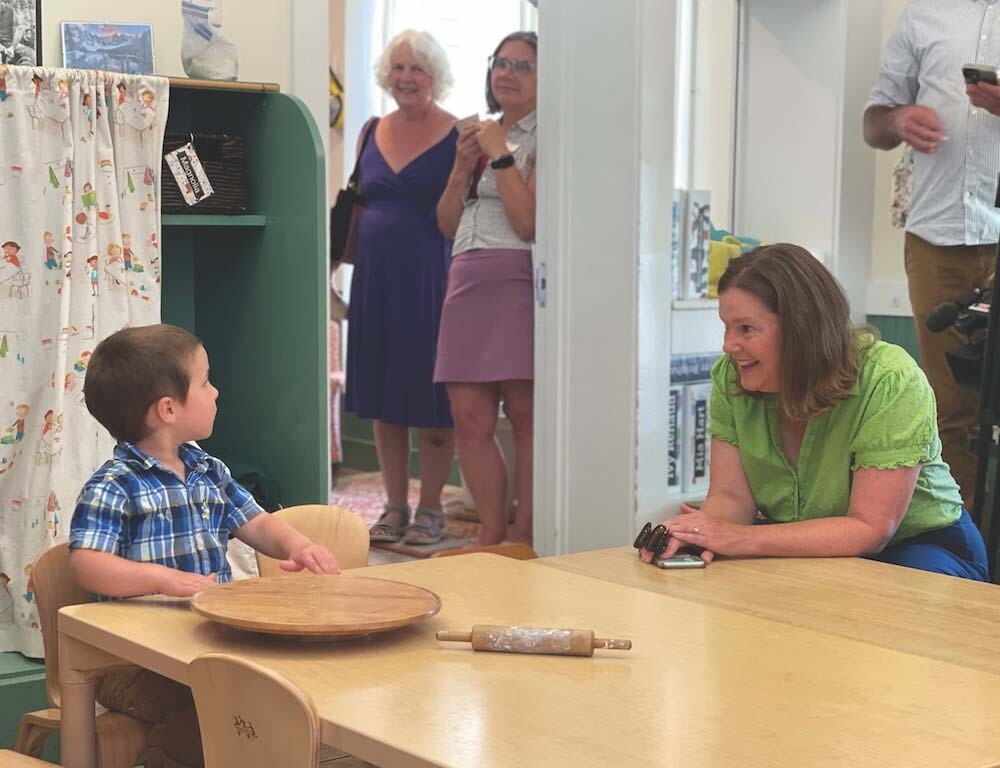 STATE SEN. RUTH Hardy, D-Middlebury, converses with 3-year-old Lucas during a recent tour of the Mary Johnson Children’s Center. Independent photo/John Flowers